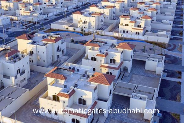 A wide-angle view of residential villas in Al Samha, Abu Dhabi, with neatly arranged houses and roads creating an organized suburban layout.