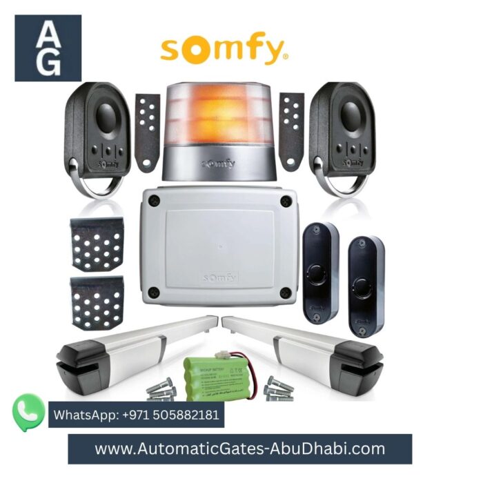 SOMFY IXENGO swing gate motor kit including two motors, control board, flashing light, remote controls, safety sensors, and battery backup.