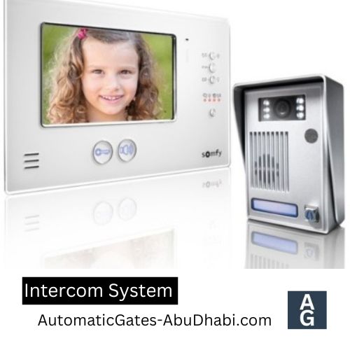 Intercom system with a video display showing a child and a separate hand-held unit.