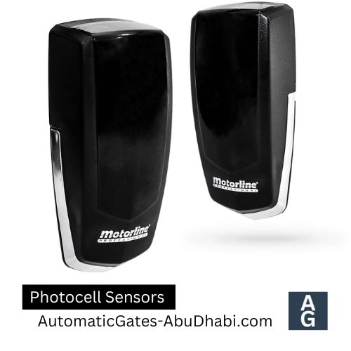 Two black photocell sensors with silver accents, displaying the Motorline brand.