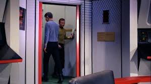 Early automatic sliding door installed in a commercial setting.